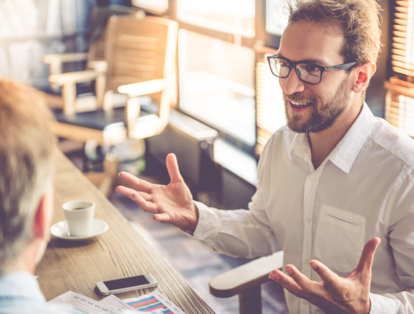 Handsome,Businessmen,Are,Discussing,Affairs,And,Smiling,While,Working,In